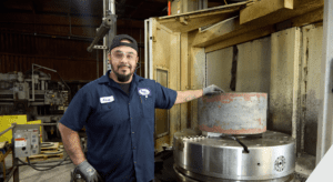 man in front of large CNC machine